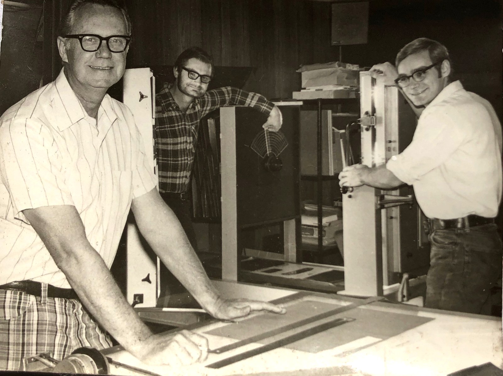 The original White Graphics shop in 1971: Dick White Sr. at the light table, Rich White Jr., and Mike White at the press